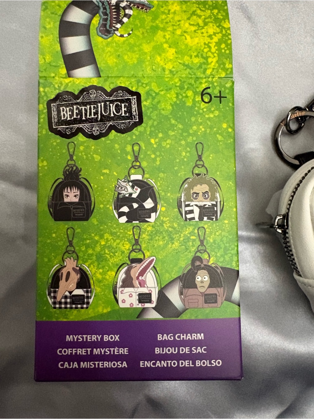 Loungefly Beetlejuice Mystery Box Bag Charm Display - Green, Black, Purple